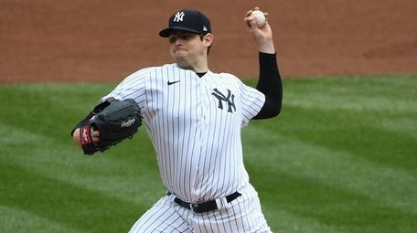 Yankees starting pitcher Jordan Montgomery delivers against the