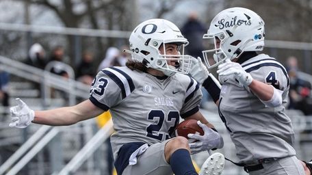 Oceanside's Nick Ebel (23) celebrates his second touchdown
