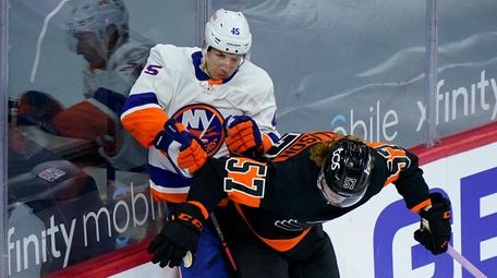 The Flyers' Wade Allison and Islanders' Braydon Coburn