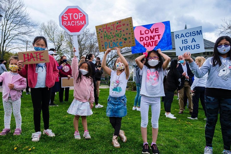 Youngsters display signs during a rally at Mary