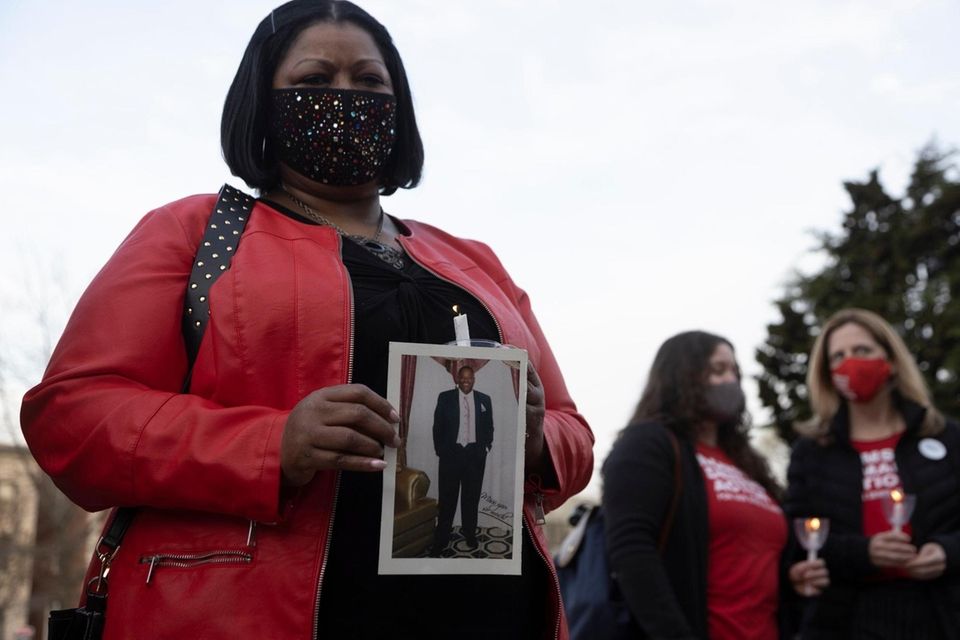 Jawana Richardson attends a candlelight vigil in honor
