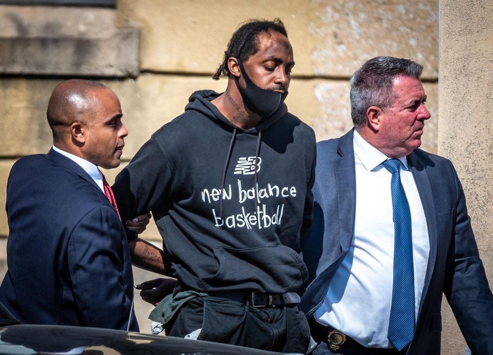 Nassau County police take into custody the suspect