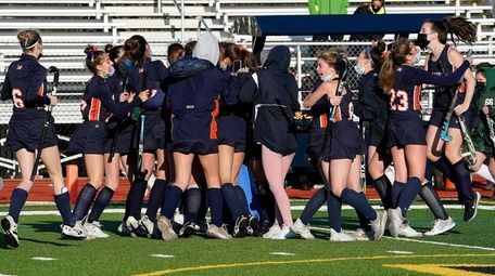 Manhasset field hockey celebrates its victory over Locust