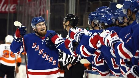 Alexis Lafreniere of the Rangers celebrates his goal