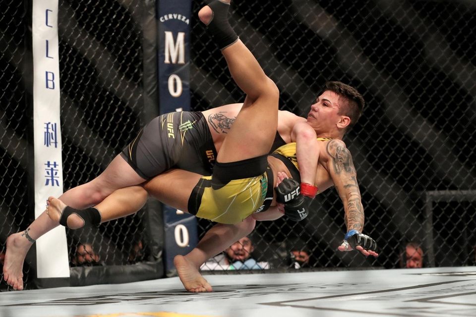 Valentina Shevchenko of Kyrgystan throws Jessica Andrade of