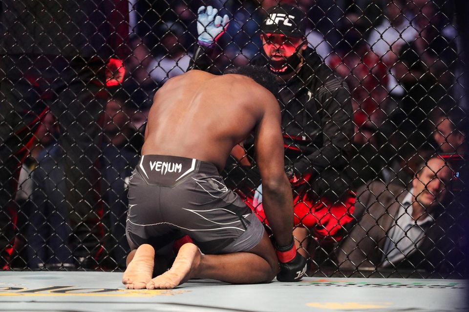 Uriah Hall of Jamaica talks to his corner