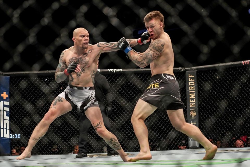 Anthony Smith of the United States punches Jim