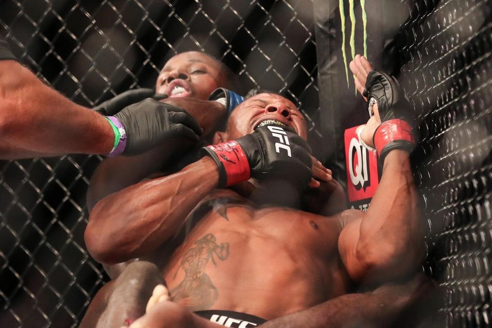 Randy Brown of Jamiaica forces Alex Oliveira of