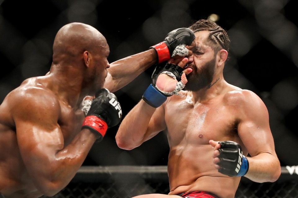 Kamaru Usman of Nigeria punches Jorge Masvidal of