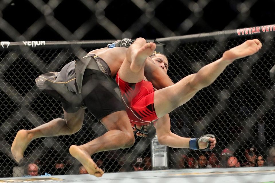 Kamaru Usman of Nigeria throws down Jorge Masvidal