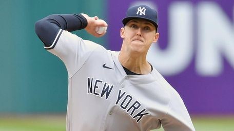 Yankees starting pitcher Jameson Taillon throws during the