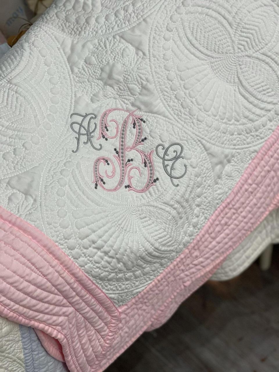 A made-to-order monogram quilt is a family keepsake