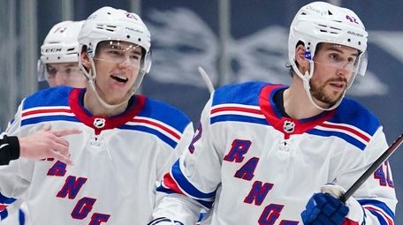 New York Rangers' Brendan Smith, right, and Libor