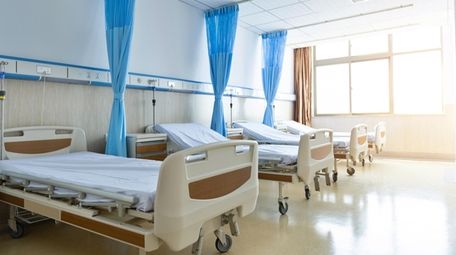 Empty hospital beds.