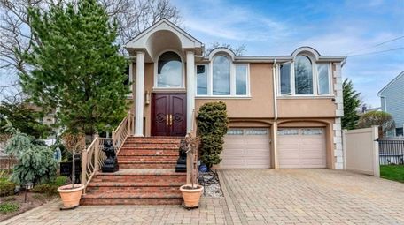 Priced at $729,000, this three-bedroom, three-bathroom high ranch