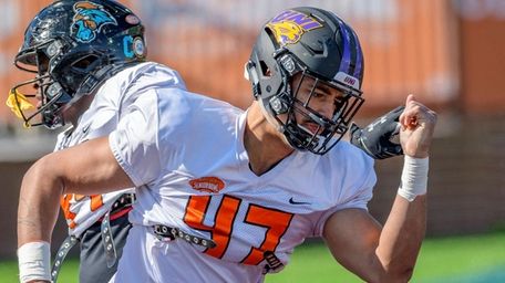 Elerson Smith of Northern Iowa (47) runs a