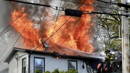 Flames on the roof of a home Sunday