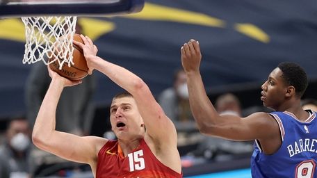 Nikola Jokic #15 of the Denver Nuggets dunks