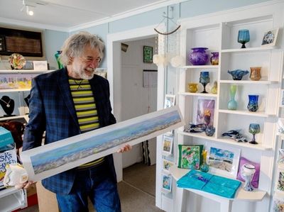 Artist Bob Kuhne his work "Foamy Sea," which