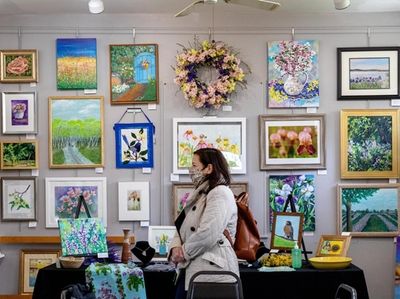 Maria Vizzi peruses the artwork at The Old