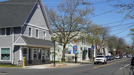 Businesses and houses on Main Street in Islip