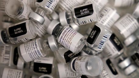 Empty vials of the Pfizer-BioNTech COVID-19 vaccine are