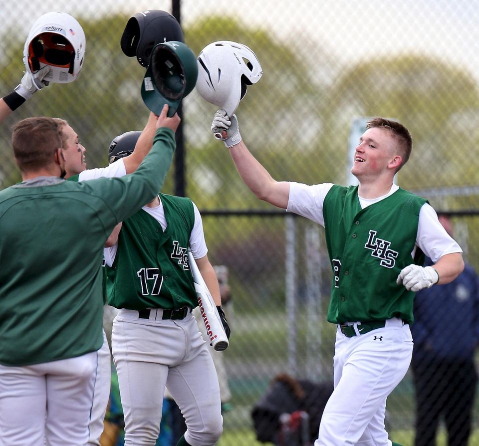 Longwood's Louis Kaleb is congratulated at home plate