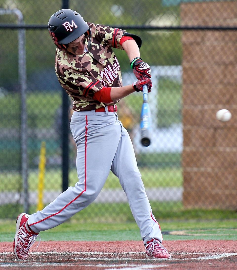Patchogue-Medford's Patrick Dallas drills an RBI single to