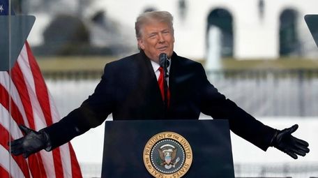 Then-President Donald Trump speaks to supporters at the