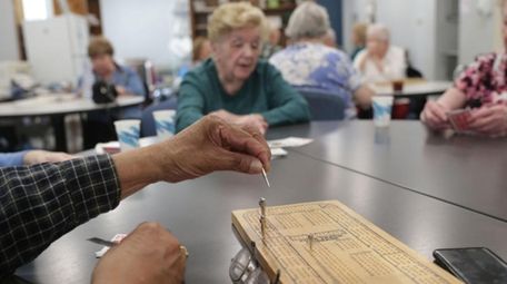 Playing cribbage at a senior center in Billerica,