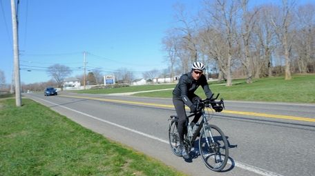 A bicyclist on Sound Avenue in Baiting Hollow.