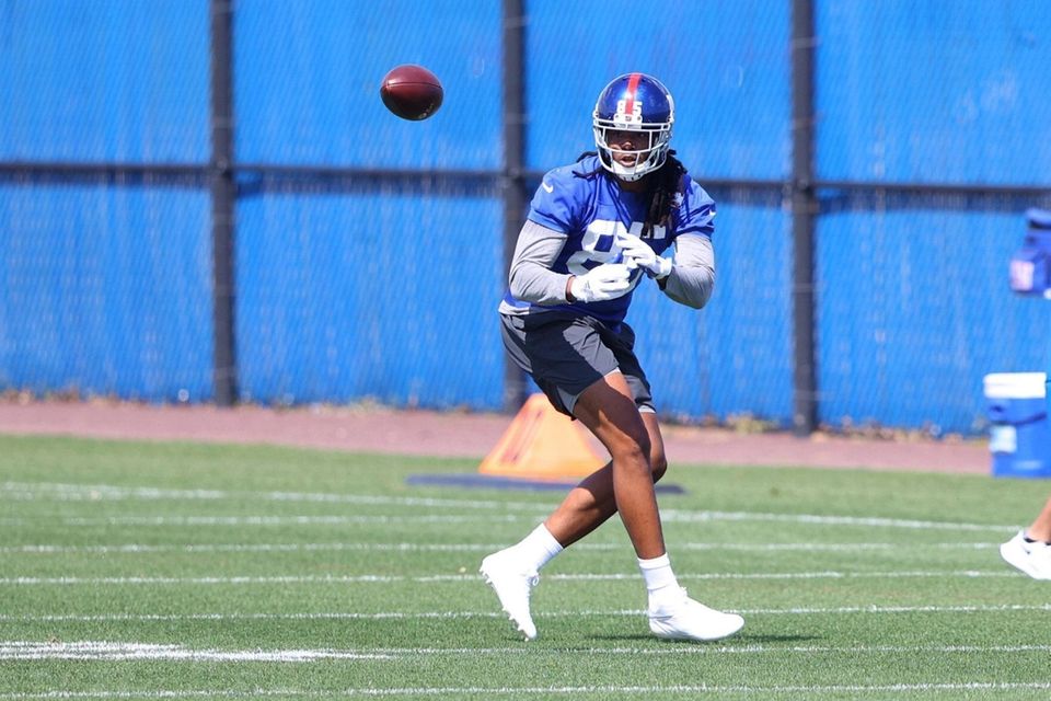 Kelvin Benjamin of the Giants runs drills during
