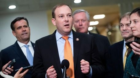 Rep. Lee Zeldin, center, conducts a news conference