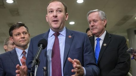 Rep. Lee Zeldin speaks to reporters during President