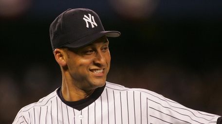 Derek Jeter smiles after making a nice play