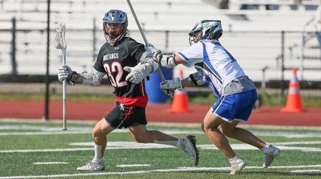 Mt Sinai's Nick Colantonio (32) looks to get