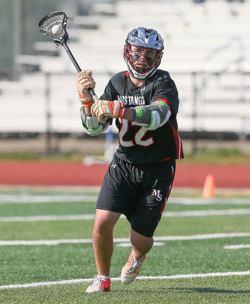Mt Sinai's Joey Spallina (22) looks to pass