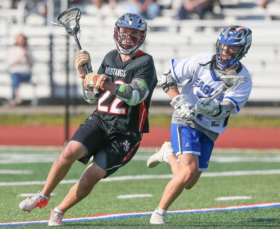 Mt Sinai's Joey Spallina (22) looks to get