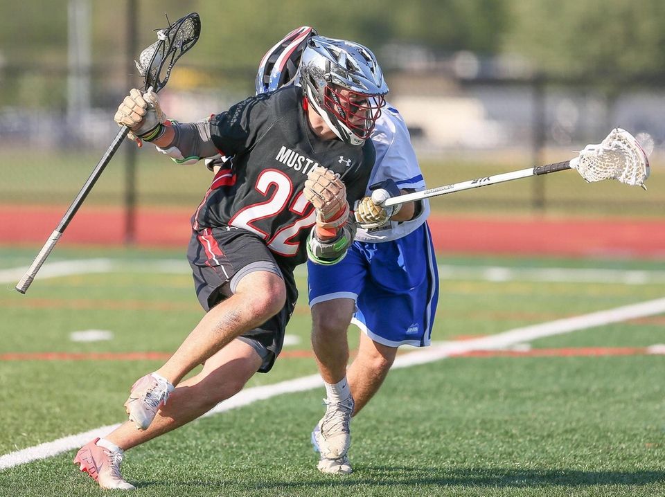 Mt Sinai's Joey Spallina (22) looks to get