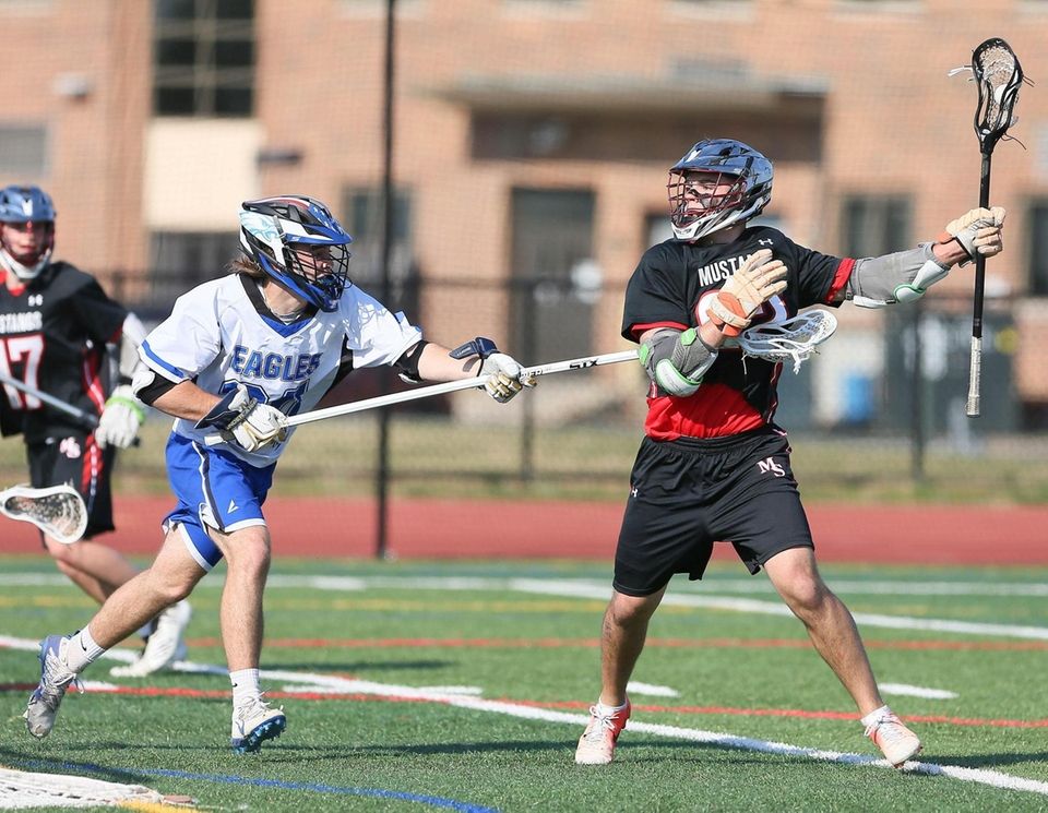 Mt Sinai's Joey Spallina (22) looks to get