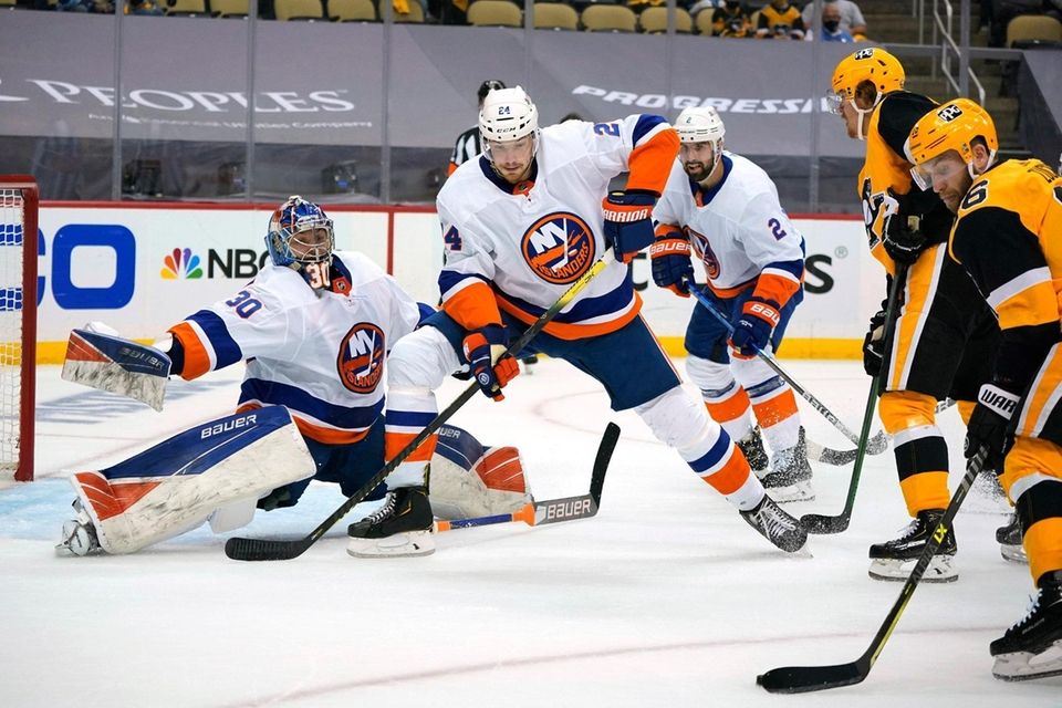 Pittsburgh Penguins' Jason Zucker, right, can't get off