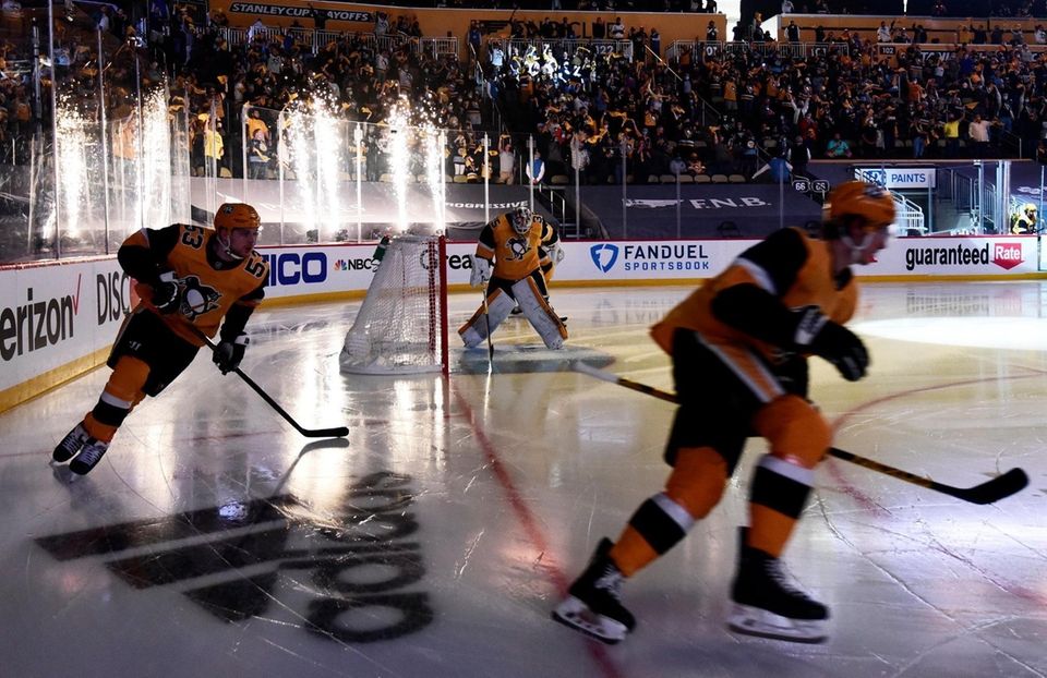 The Pittsburgh Penguins skate onto the ice prior