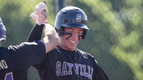 Nick Buffardi of Sayville is congratulated by Tommy