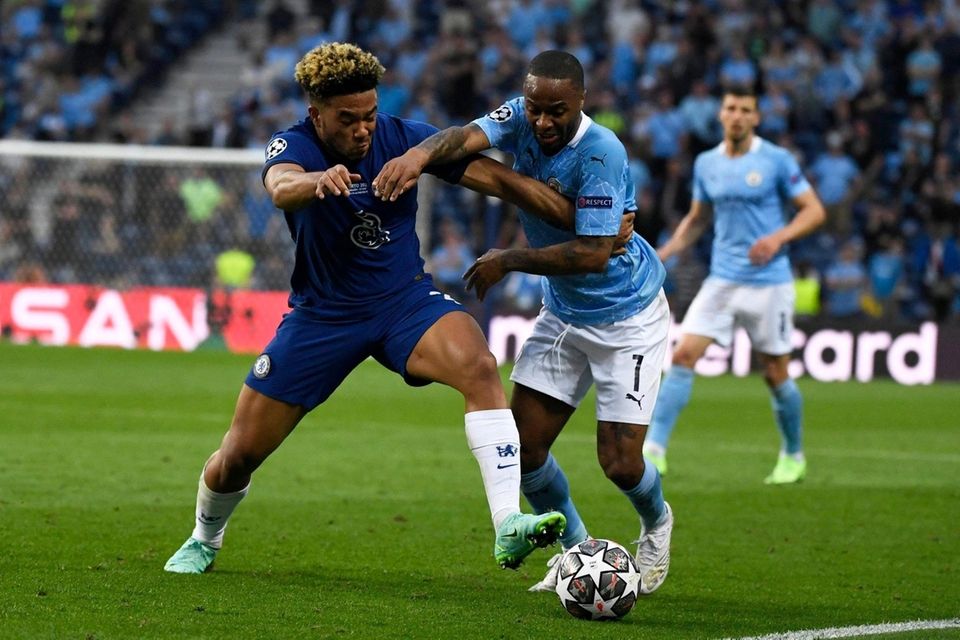 Chelsea's Reece James, left, fights for the ball