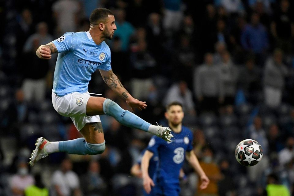 Manchester City's Kyle Walker leaps for the ball