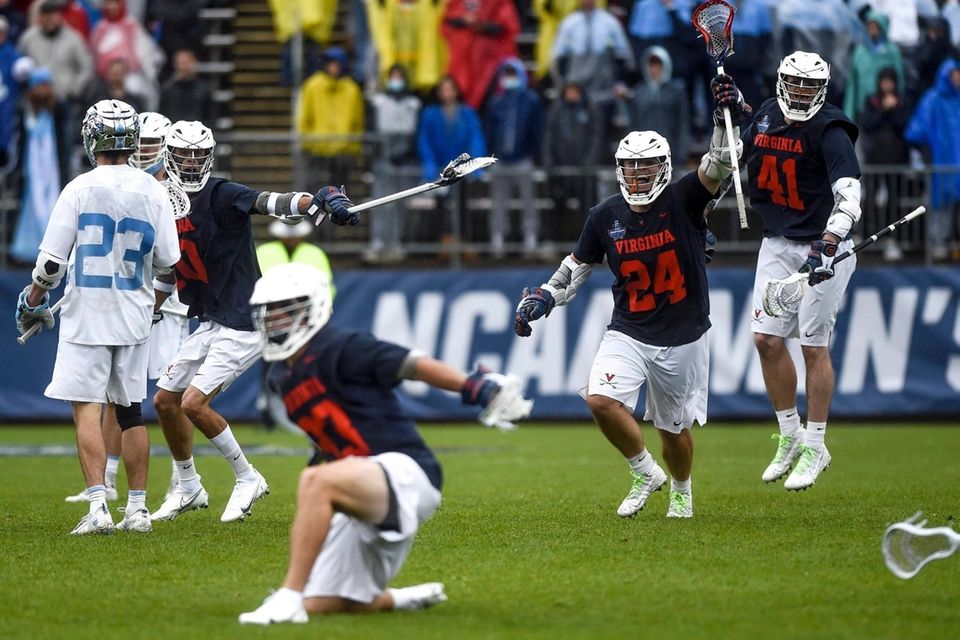 Virginia's Payton Cormier (24) and Charlie Bertrand (41)