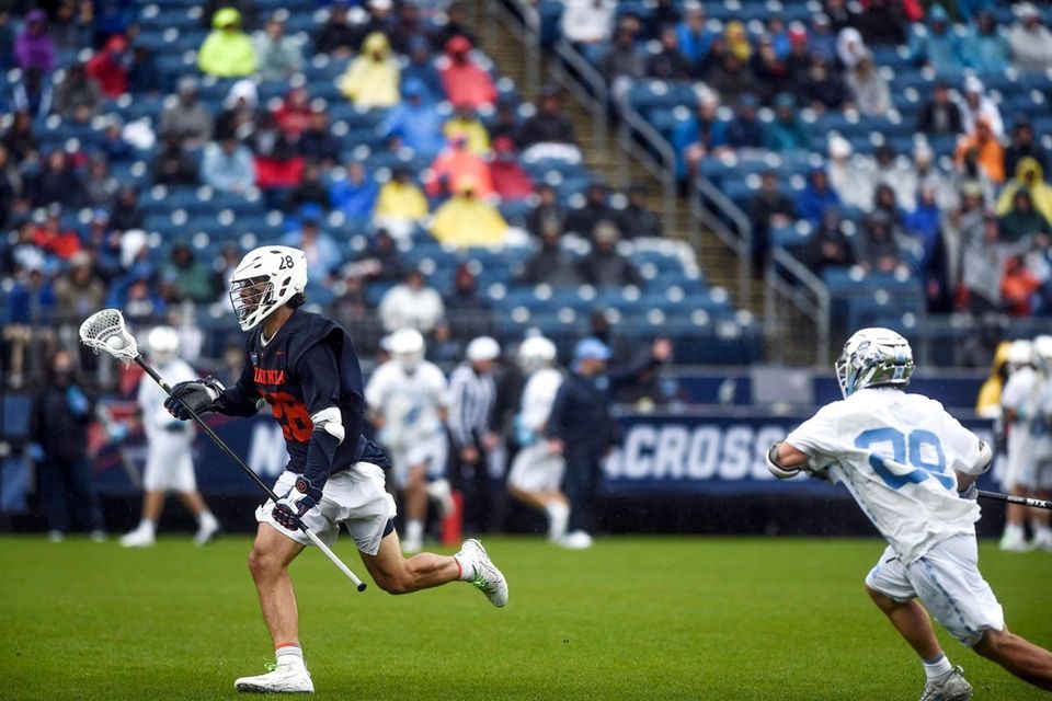 Virginia's Jared Conners (28) drives down the field