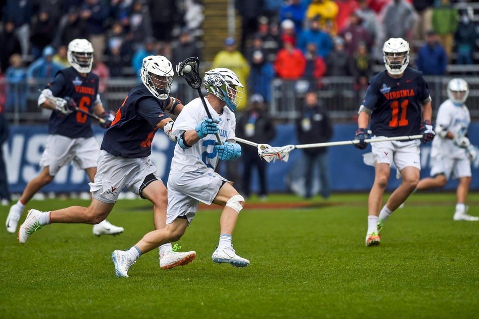North Carolina's Henry Schertzinger (2) drives the ball