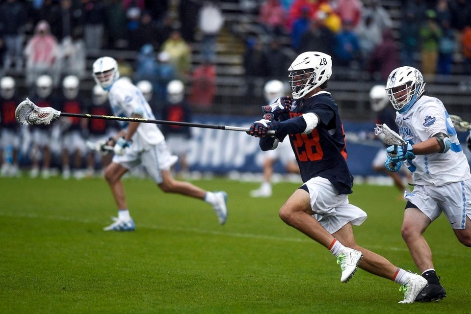 Virginia's Jared Conners (28) drives down the field