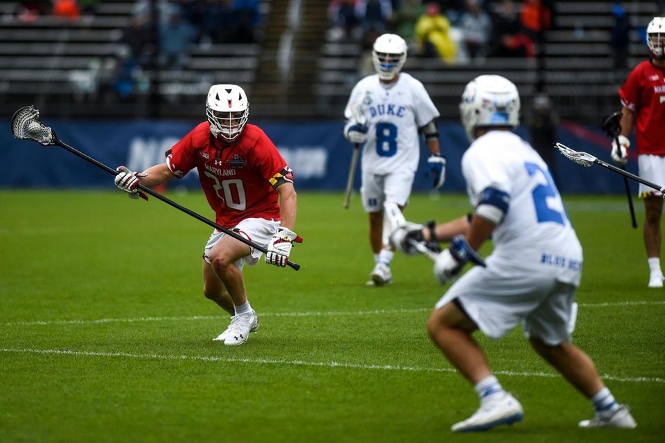 Duke's Jake Caputo (6) guards Maryland's Eric Malever